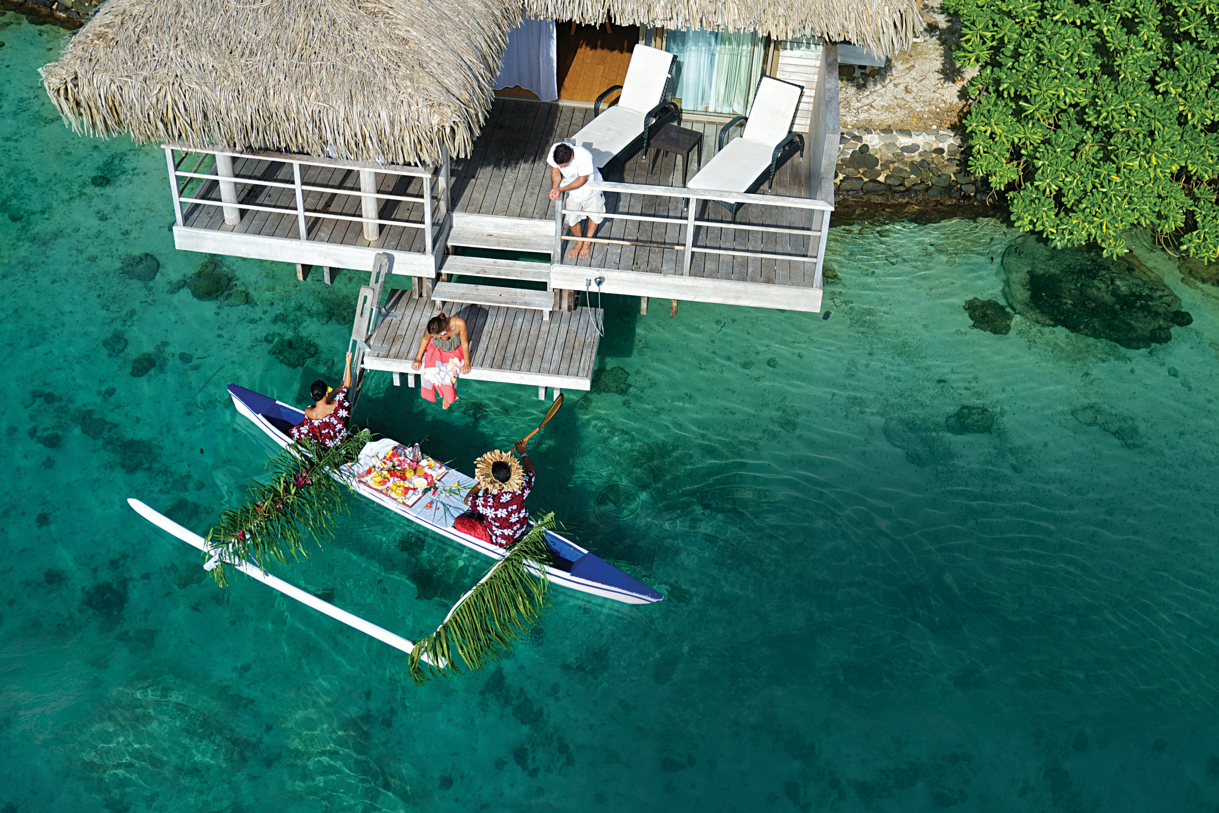 overwater bungalow canoe breakfast